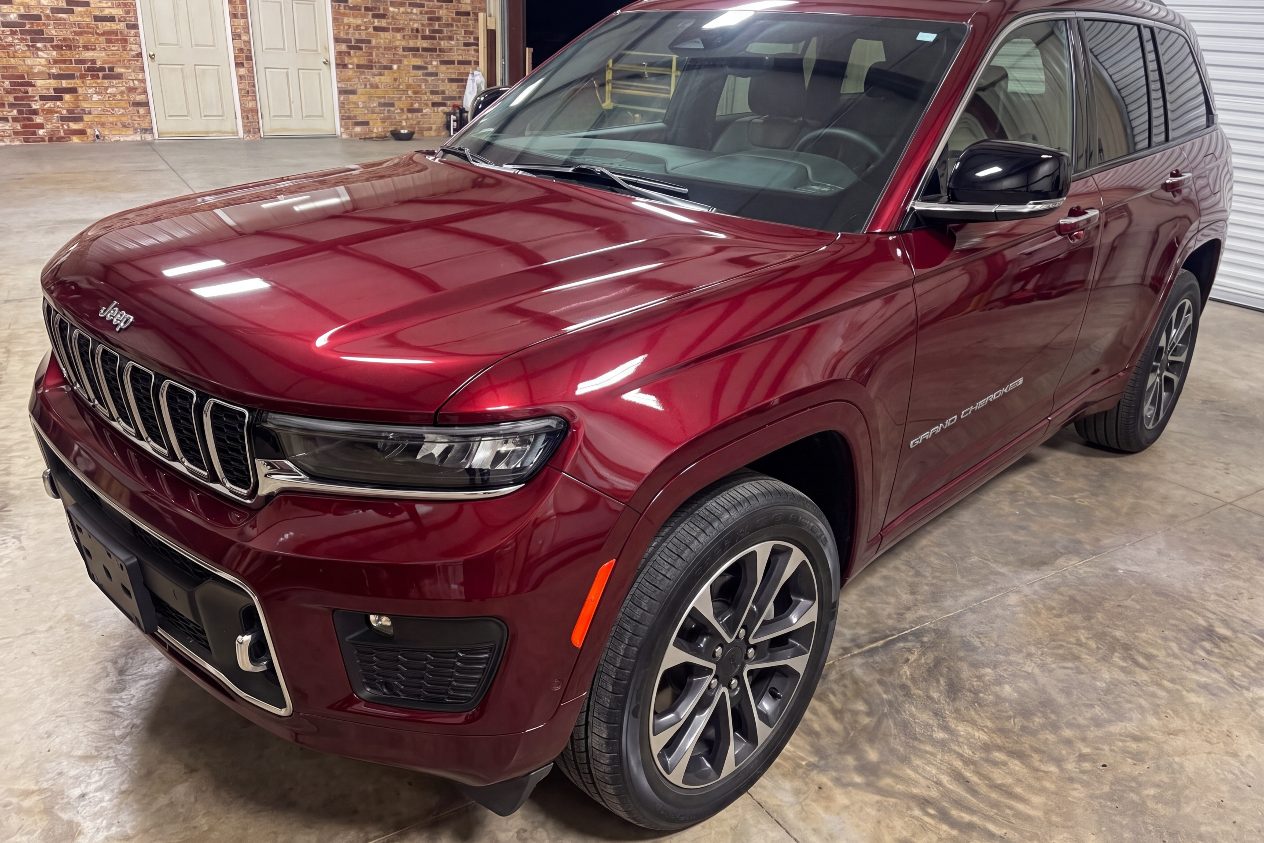 After: the same dark red SUV finished, the panel matching the rest of the paint
